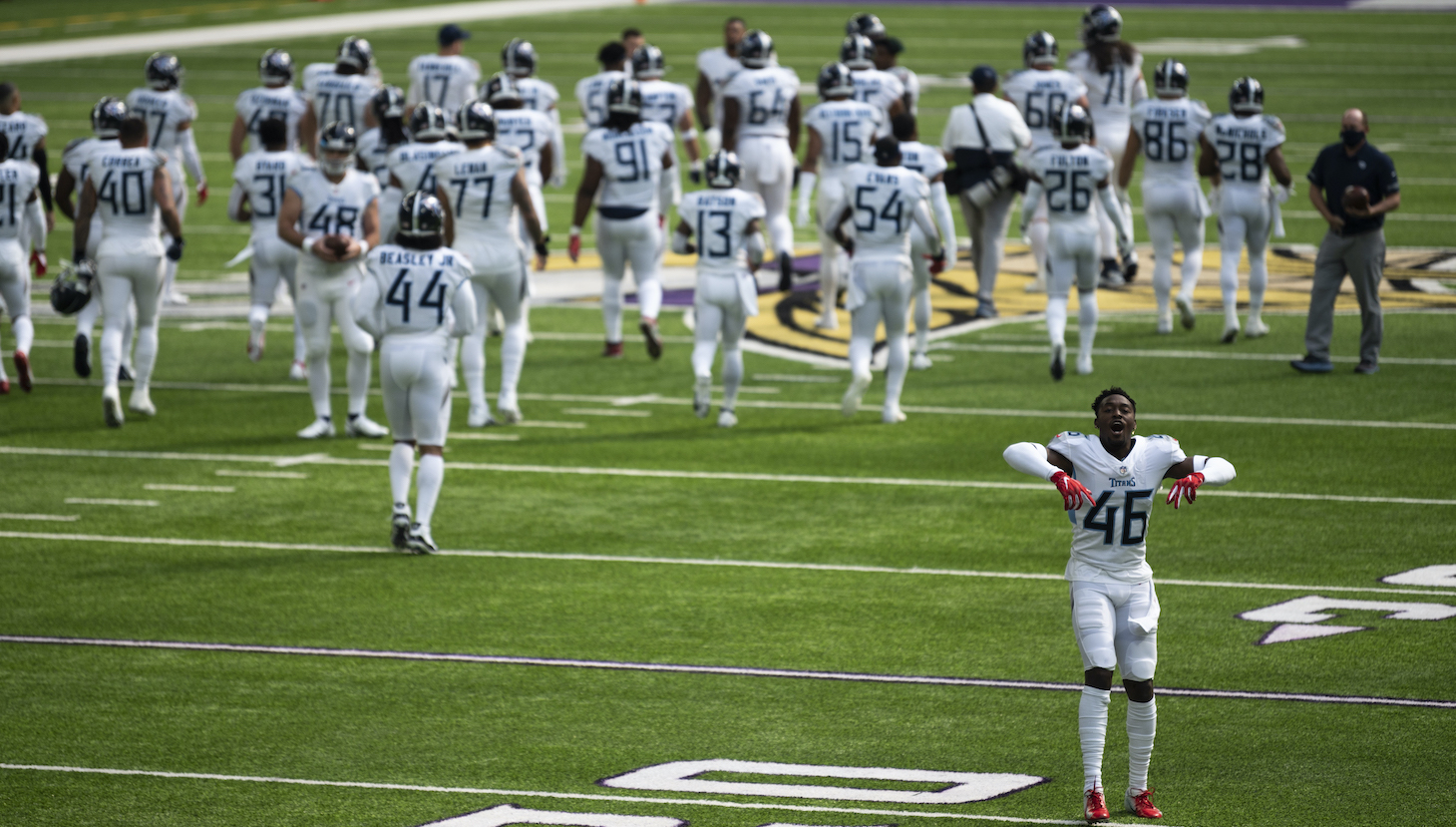 Joshua Kalu #46 of the Tennessee Titans and his teammates take the field before the game against the Minnesota Vikings at U.S. Bank Stadium on September 27, 2020 in Minneapolis, Minnesota.