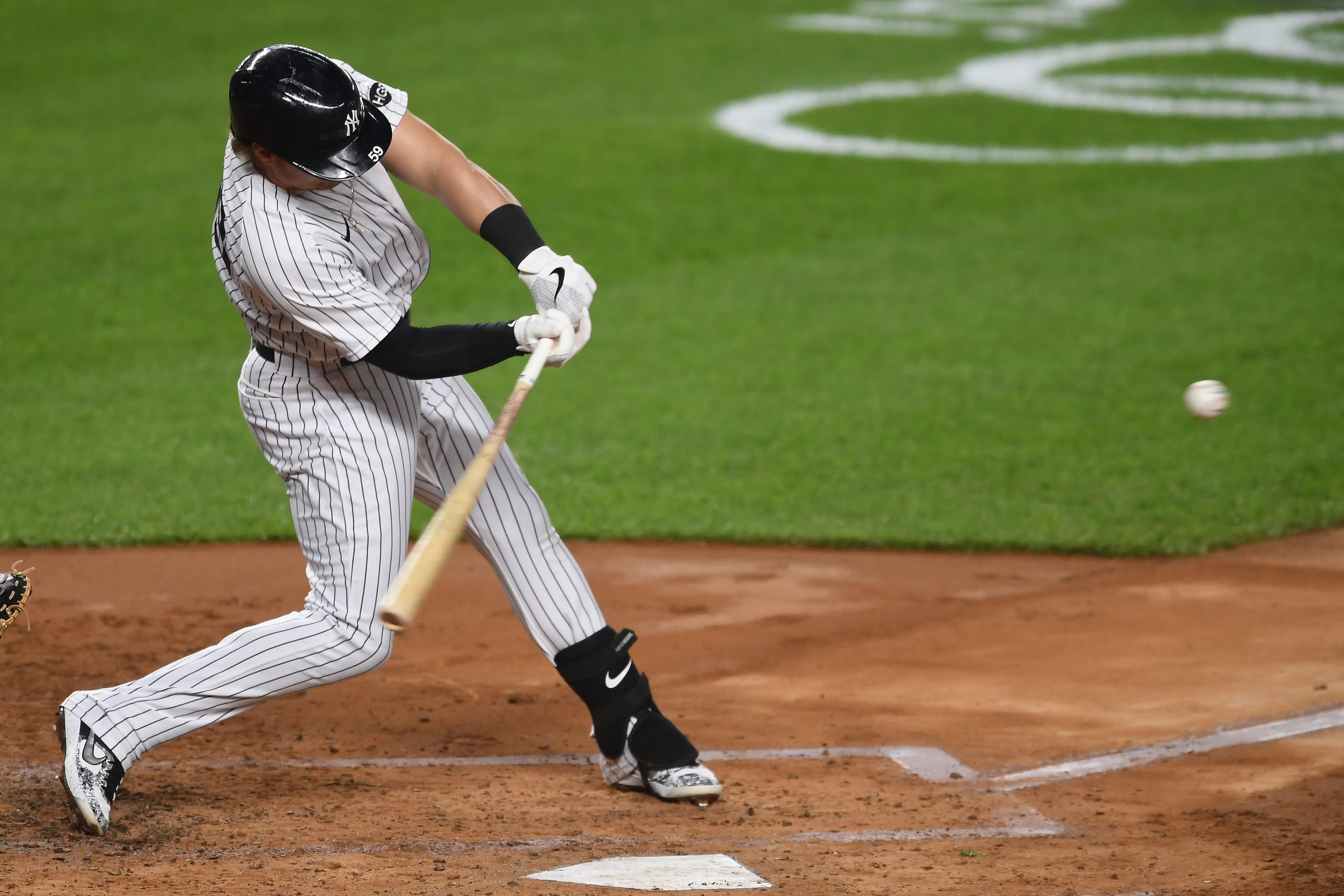 Luke Voit #59 of the New York Yankees hits a three-run home run during the second inning against the Toronto Blue Jays at Yankee Stadium