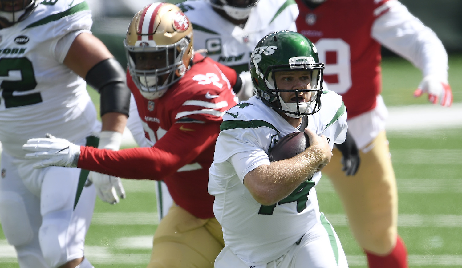 Sam Darnold of the Jets tries to avoid a sack.