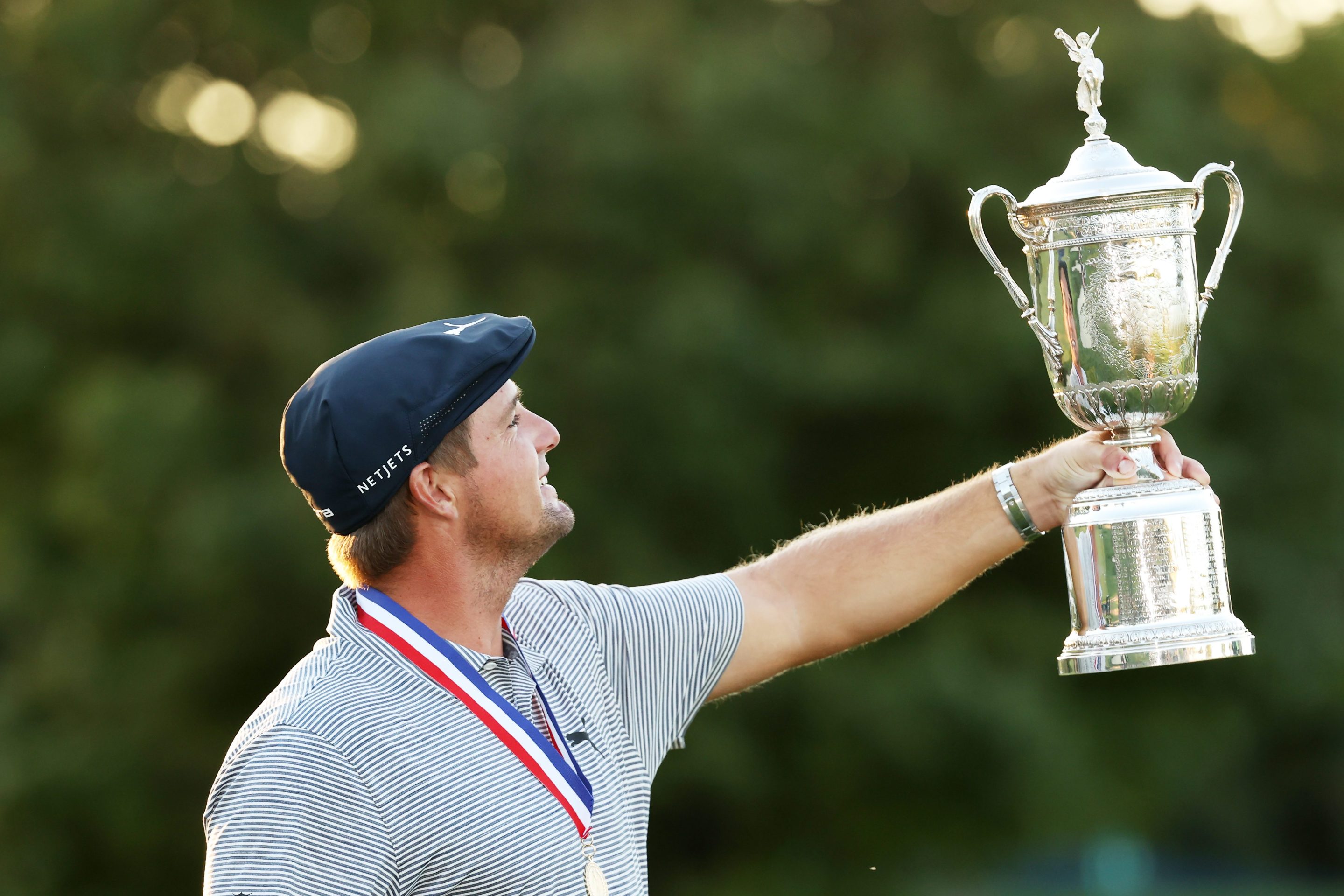 Bryson DeChambeau admires the U.S. Open Championship Trophy after winning the 2020 U.S. Open at Winged Foot.