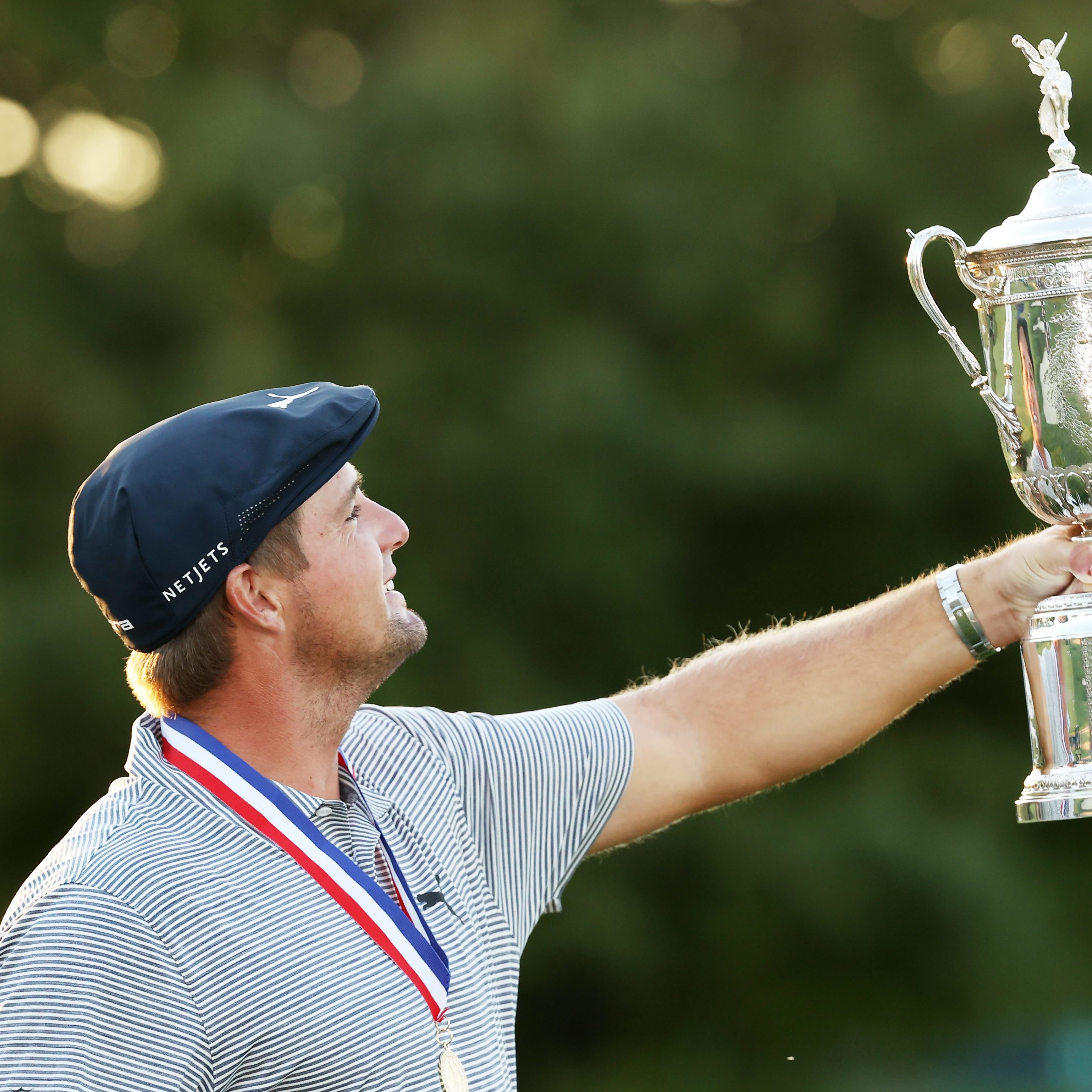 Bryson DeChambeau admires the U.S. Open Championship Trophy after winning the 2020 U.S. Open at Winged Foot.