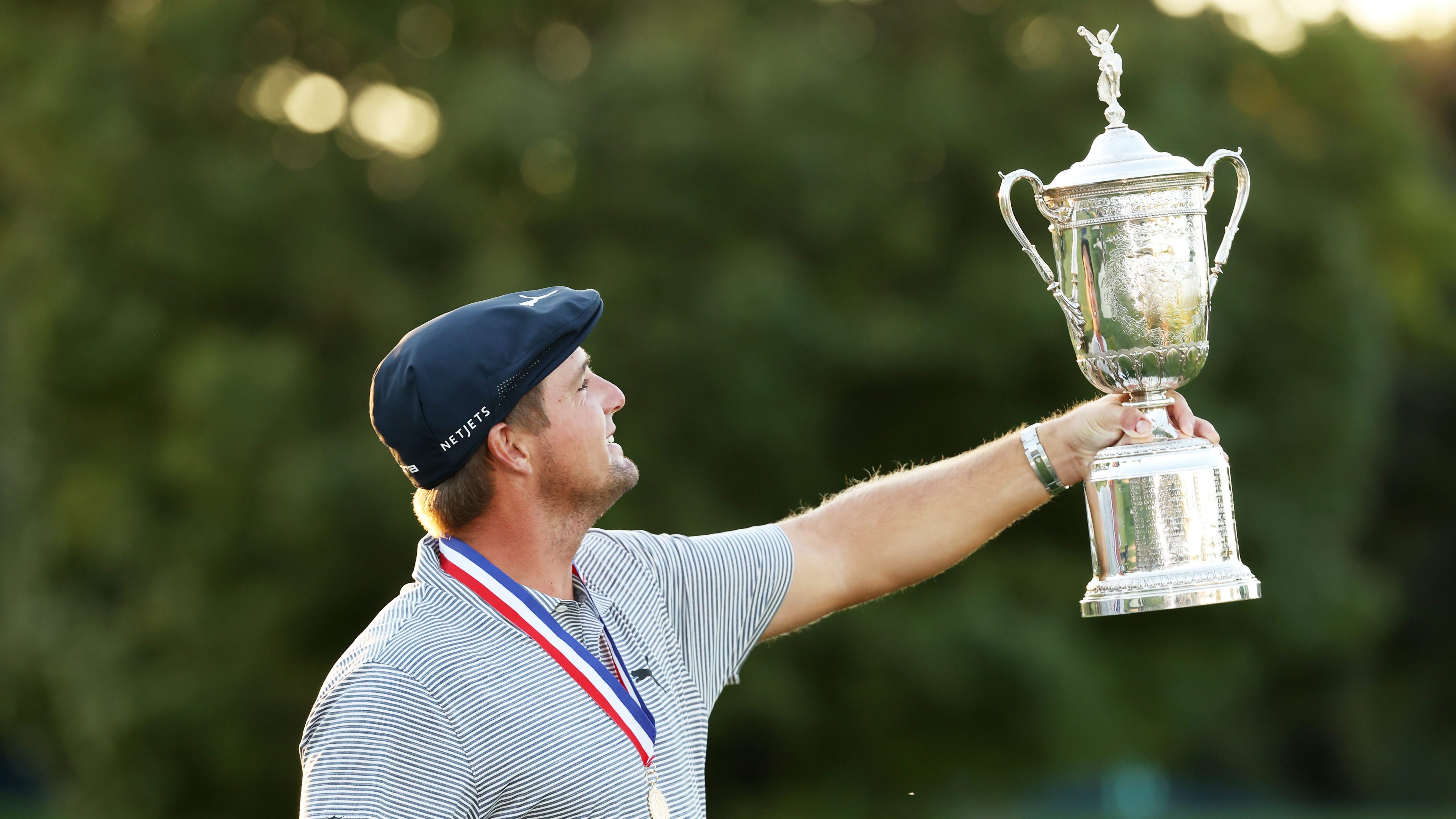 Bryson DeChambeau admires the U.S. Open Championship Trophy after winning the 2020 U.S. Open at Winged Foot.