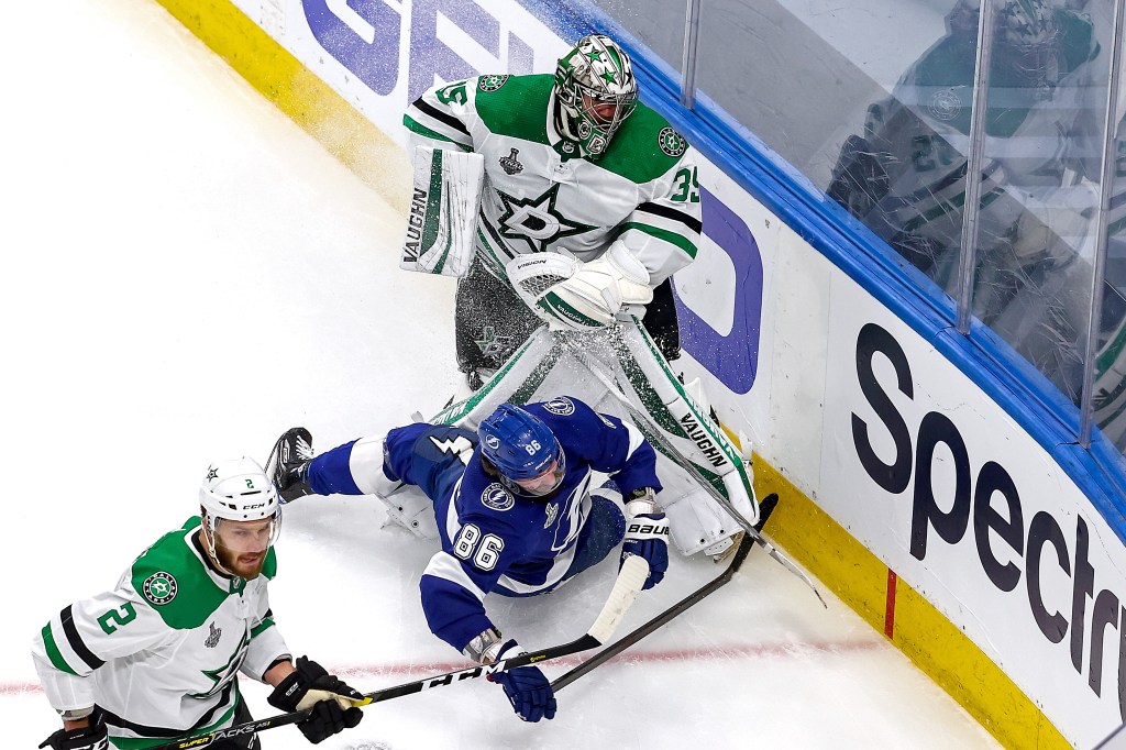 Nikita Kucherov #86 of the Tampa Bay Lightning collides into Anton Khudobin #35 of the Dallas Stars