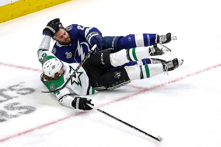 Roope Hintz #24 of the Dallas Stars gets tried up with Kevin Shattenkirk #22 of the Tampa Bay Lightning