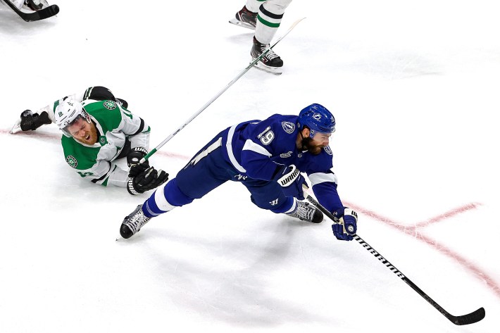 Joe Pavelski #16 of the Dallas Stars gets tripped up against Barclay Goodrow #19 of the Tampa Bay Lightning