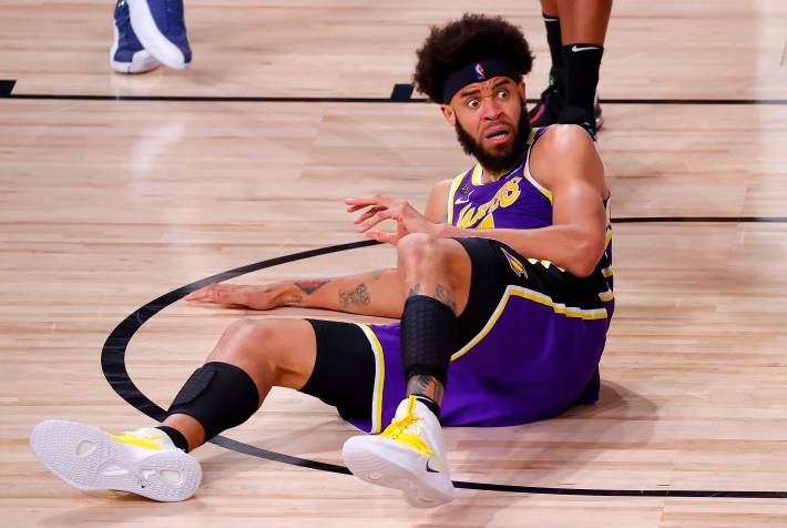 JaVale McGee of the Los Angeles Lakers makes a funny face while seated on the floor