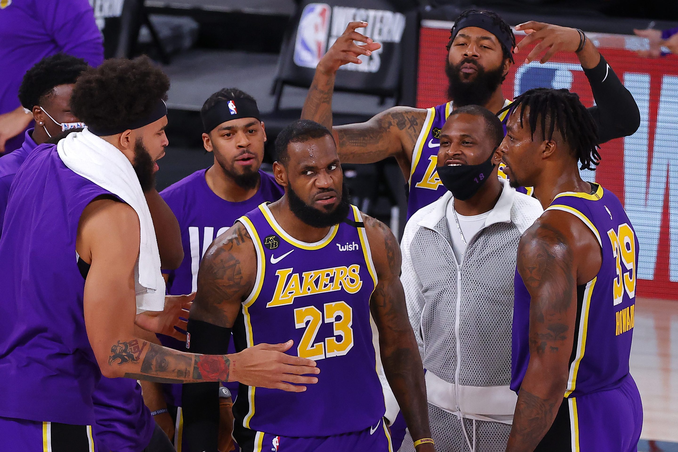 LeBron James mean-mugs while his Lakers teammates celebrate