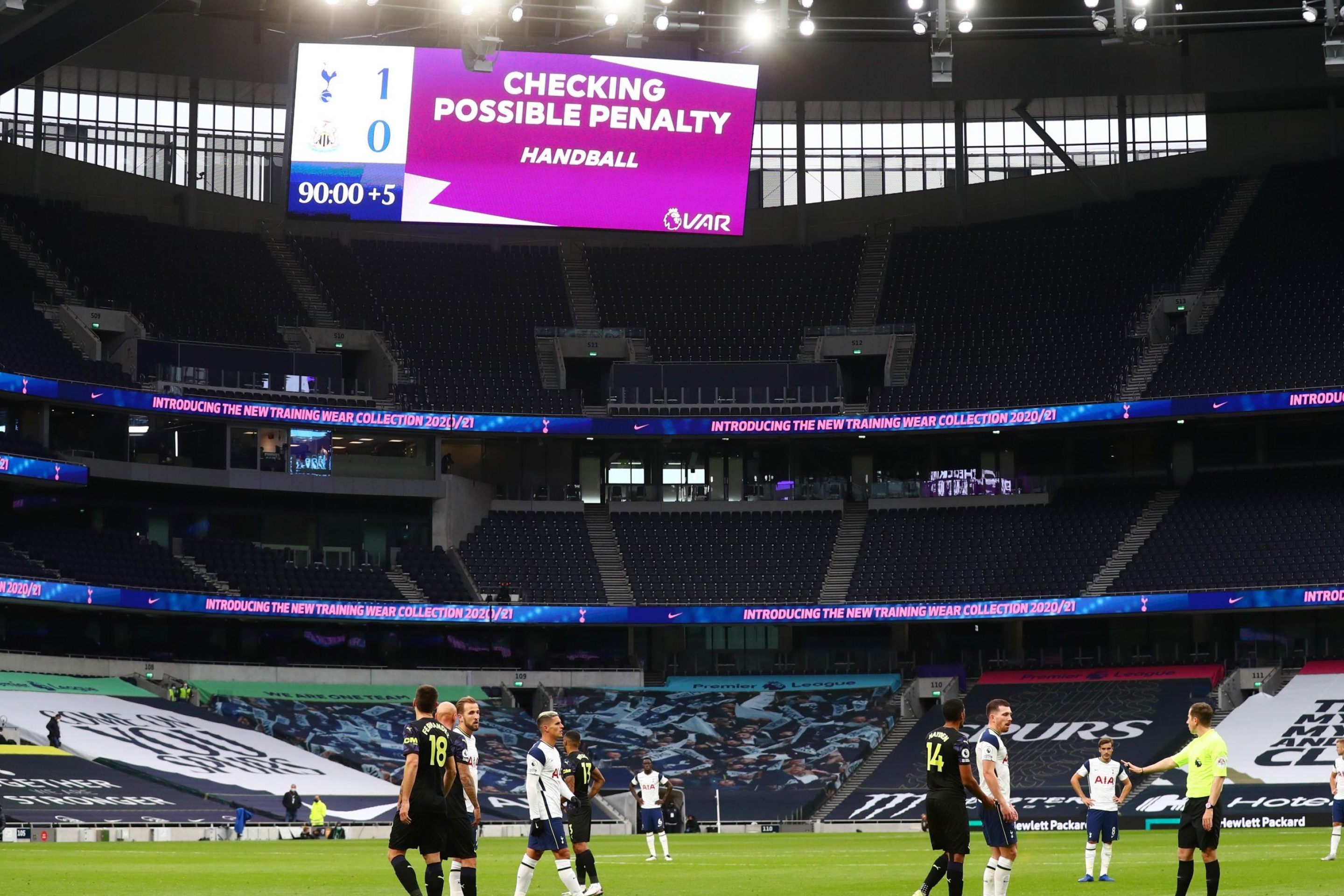A screen inside the stadium displays the decision to check VAR for a possible penalty during the Premier League match between Tottenham Hotspur and Newcastle United at Tottenham Hotspur Stadium on September 27, 2020