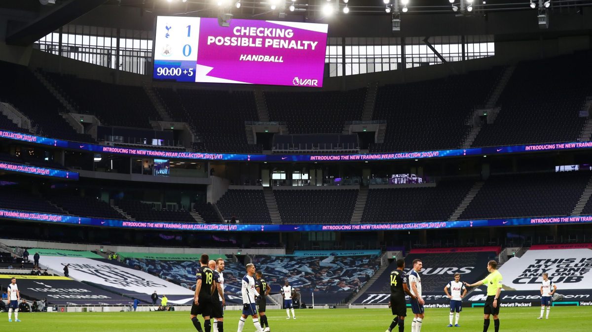 A screen inside the stadium displays the decision to check VAR for a possible penalty during the Premier League match between Tottenham Hotspur and Newcastle United at Tottenham Hotspur Stadium on September 27, 2020