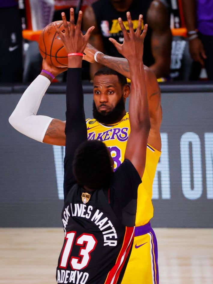 Bam Adebayo of the Miami Heat tries to annoy LeBron James of the Lakers, and looks like a tiny baby.