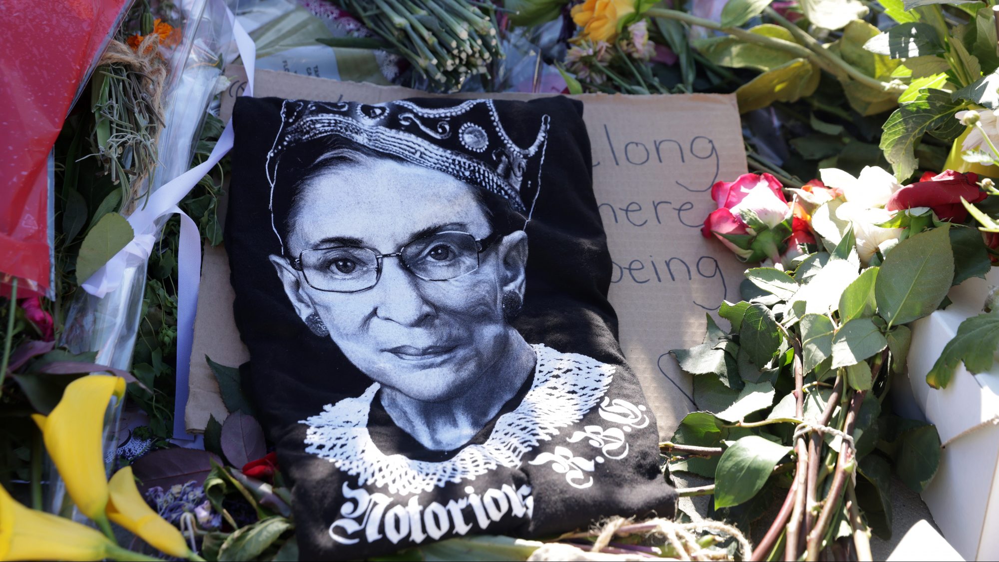 Signs and flowers are left at a makeshift memorial in front of the U.S. Supreme Court for the late Justice Ruth Bader Ginsburg September 21, 2020 in Washington, DC.