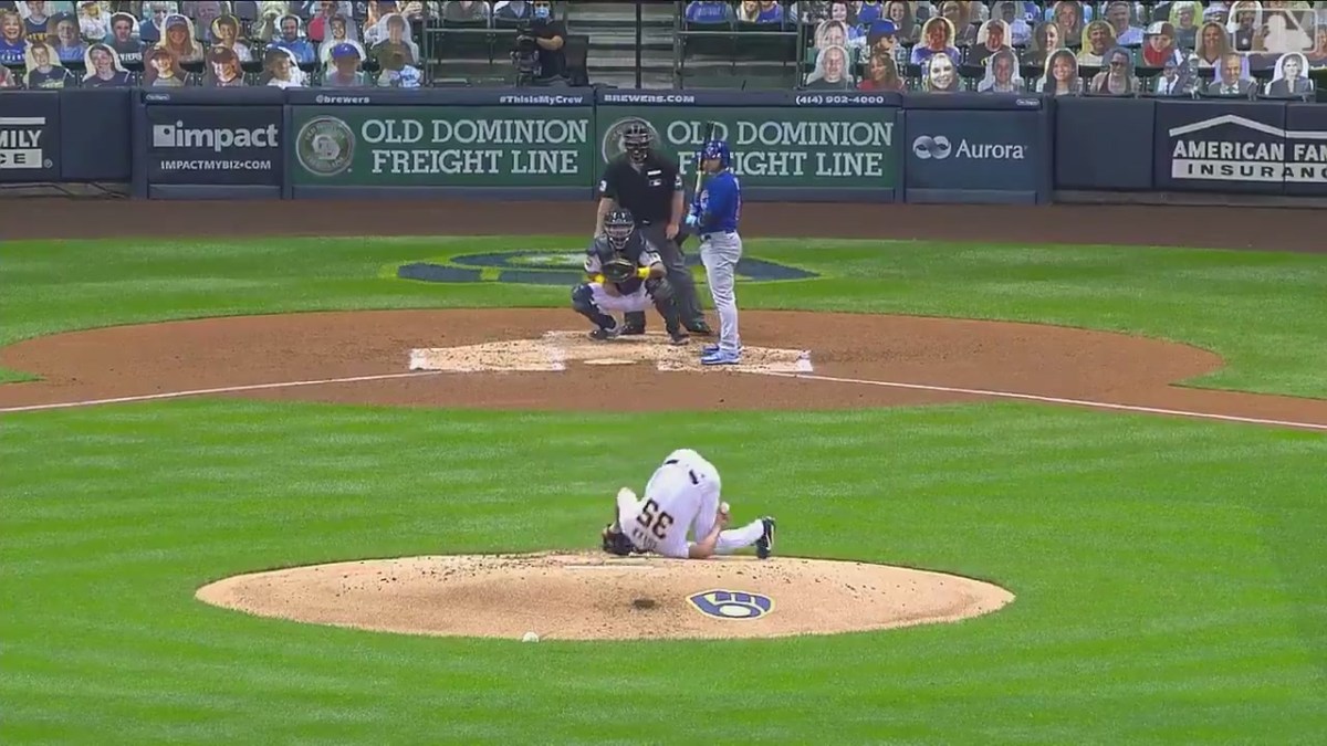 Brent Suter, falling over backwards on the mound