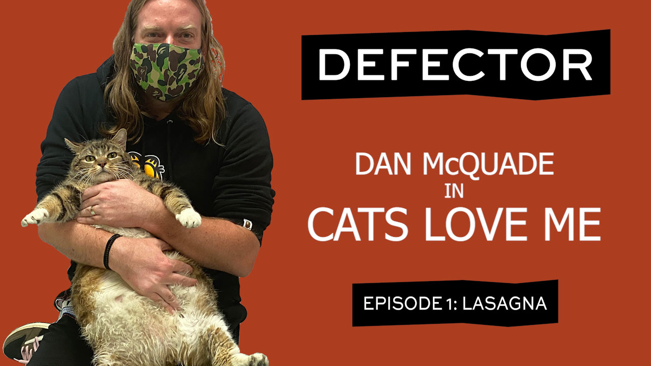 A title card. It has a man (Dan McQuade) holding a giant fat cat. He's wearing a Garfield hoodie (the man, not the cat). The header says "DEFECTOR: Dan McQuade in Cats Love Me. Episode 1: Lasagna."