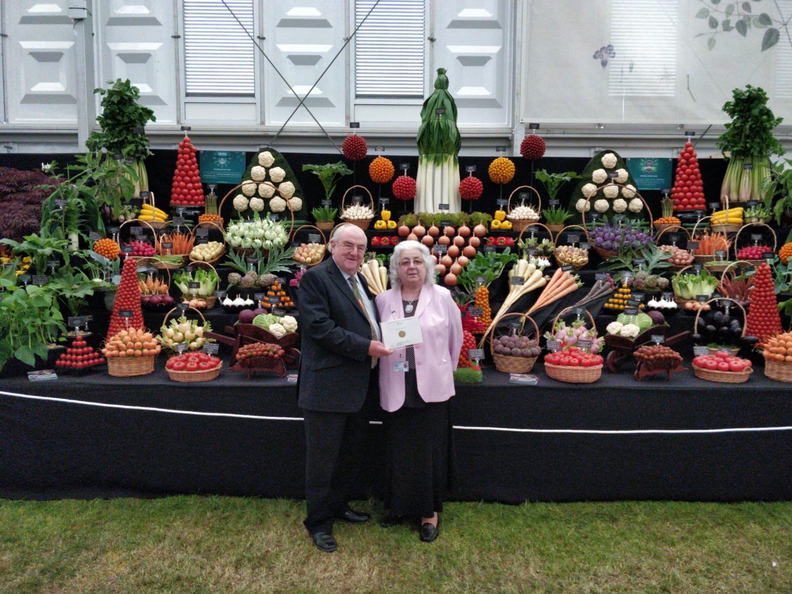 Medwyn and Gwenda Williams pose in front of their award-winning display at the 2019 Chelsea Flower Show