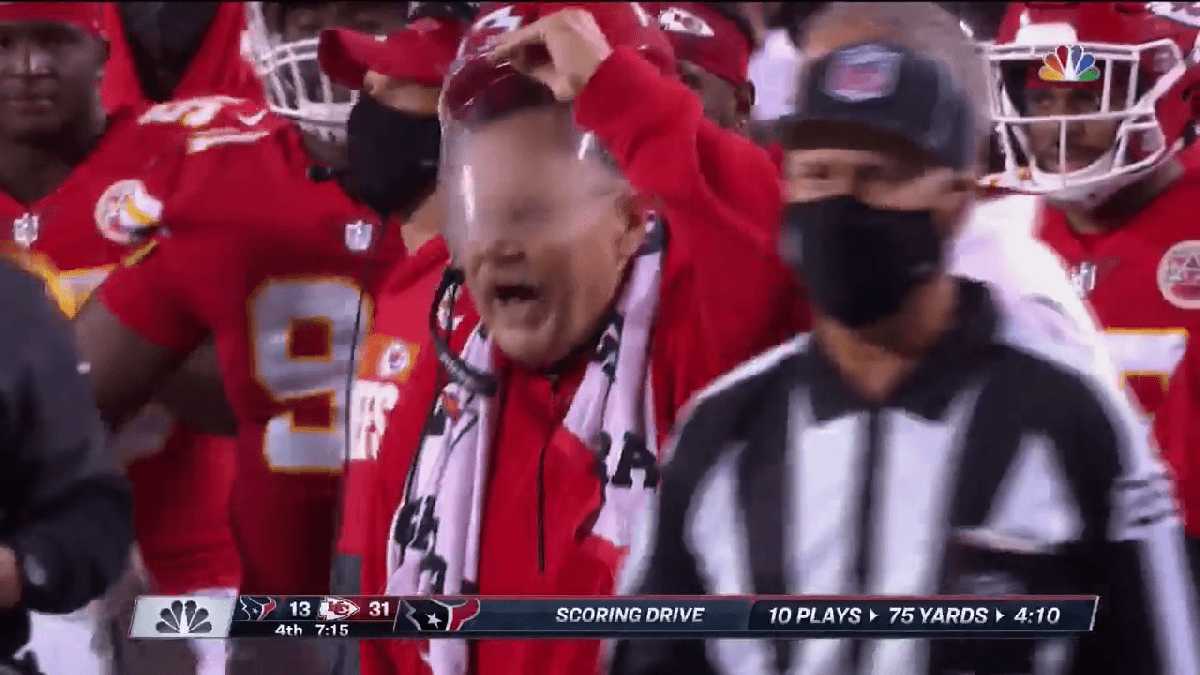 Andy Reid struggles with protective mask