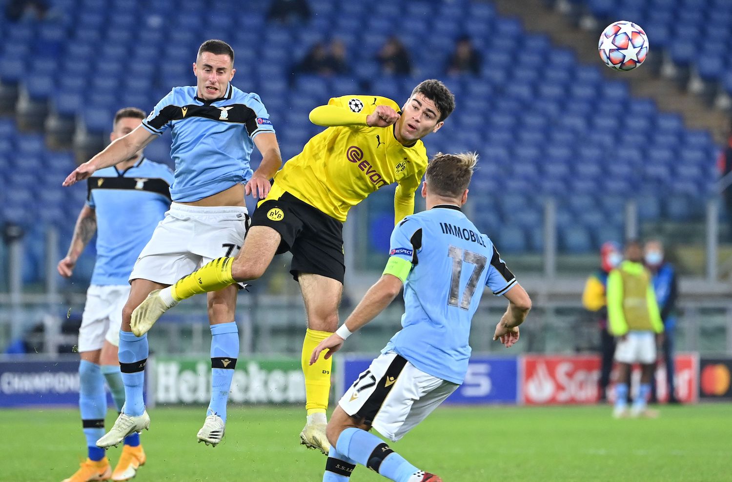 Borussia Dortmund's American forward Giovanni Reyna (C) is challenged by Lazio's Montenegrin midfielder Adam Marusic during the UEFA Champions League first round first leg, group F, football match between Lazio and Borussia Dortmund, at the Olympic stadium in Rome, on October 20, 2020. (Photo by Alberto PIZZOLI / AFP) (Photo by ALBERTO PIZZOLI/AFP via Getty Images)