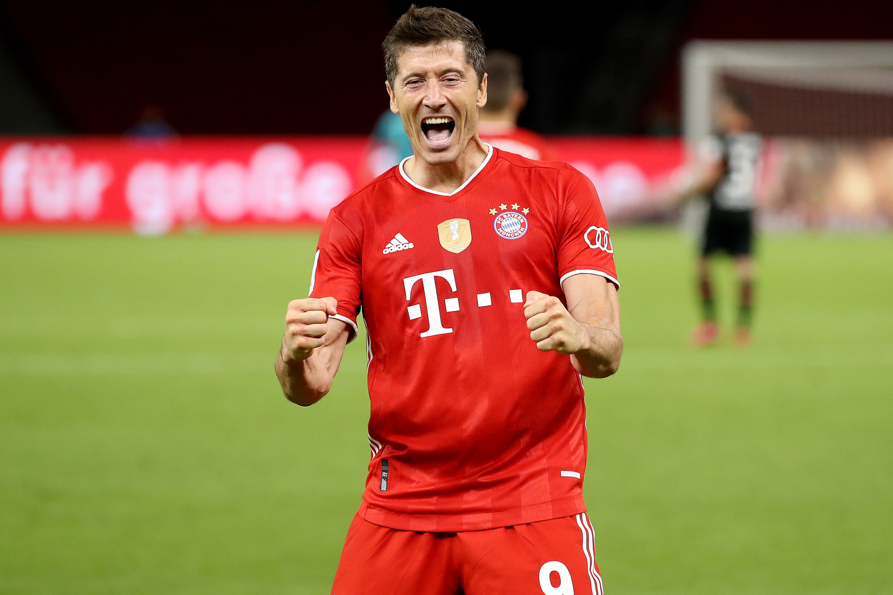 Robert Lewandowski of Bayern Muenchen celebrates scoring the 4th team goal during the DFB Cup final match between Bayer 04 Leverkusen and FC Bayern Muenchen