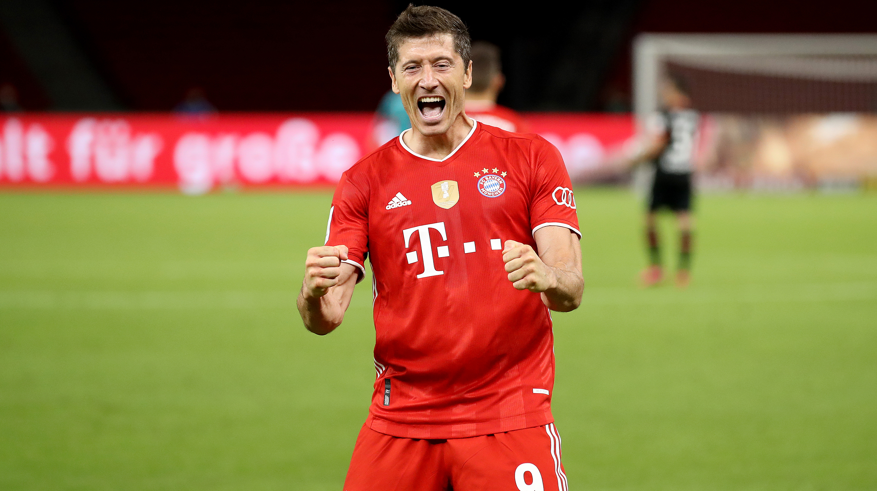 Robert Lewandowski of Bayern Muenchen celebrates scoring the 4th team goal during the DFB Cup final match between Bayer 04 Leverkusen and FC Bayern Muenchen