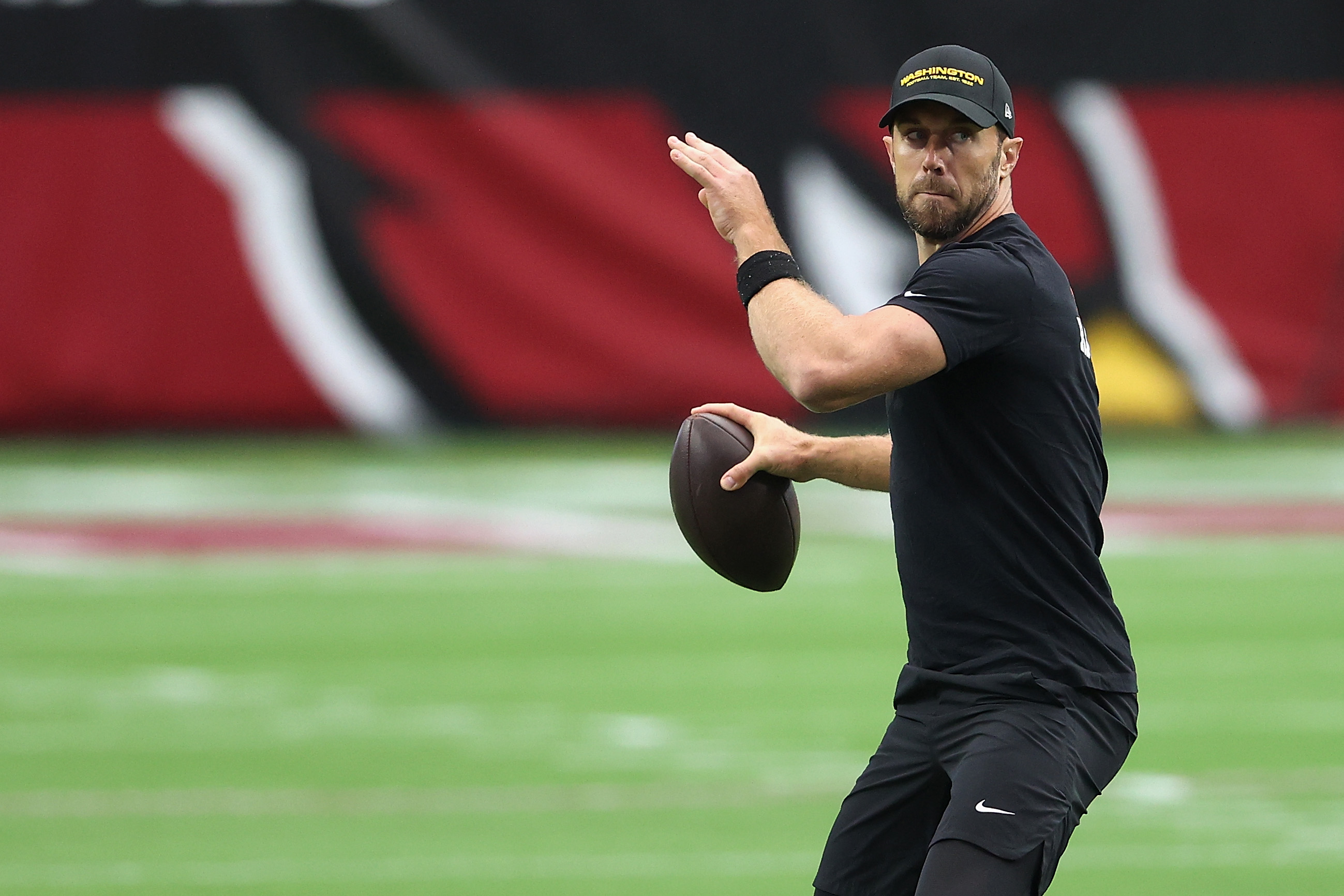 GLENDALE, ARIZONA - SEPTEMBER 20: Quarterback Alex Smith #11 of the Washington Football Team warms up before the NFL game against the Arizona Cardinals at State Farm Stadium on September 20, 2020 in Glendale, Arizona. (Photo by Christian Petersen/Getty Images)