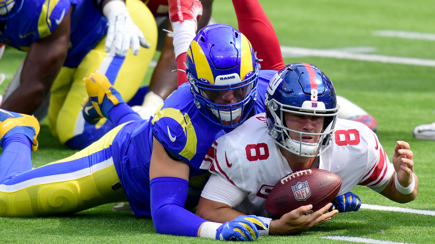 INGLEWOOD, CALIFORNIA - OCTOBER 04: Daniel Jones #8 of the New York Giants recovers his fumble as he is sacked by Morgan Fox #97 of the Los Angeles Rams during the first half at SoFi Stadium on October 04, 2020 in Inglewood, California. (Photo by Harry How/Getty Images)