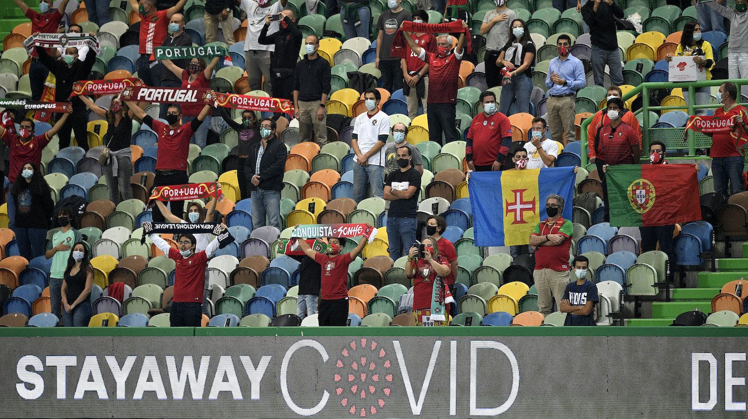 Portuguese fans wearing masks await the kick off during the international friendly match between Portugal and Spain at Estadio Jose Alvalade on October 07, 2020 in Lisbon, Portugal.