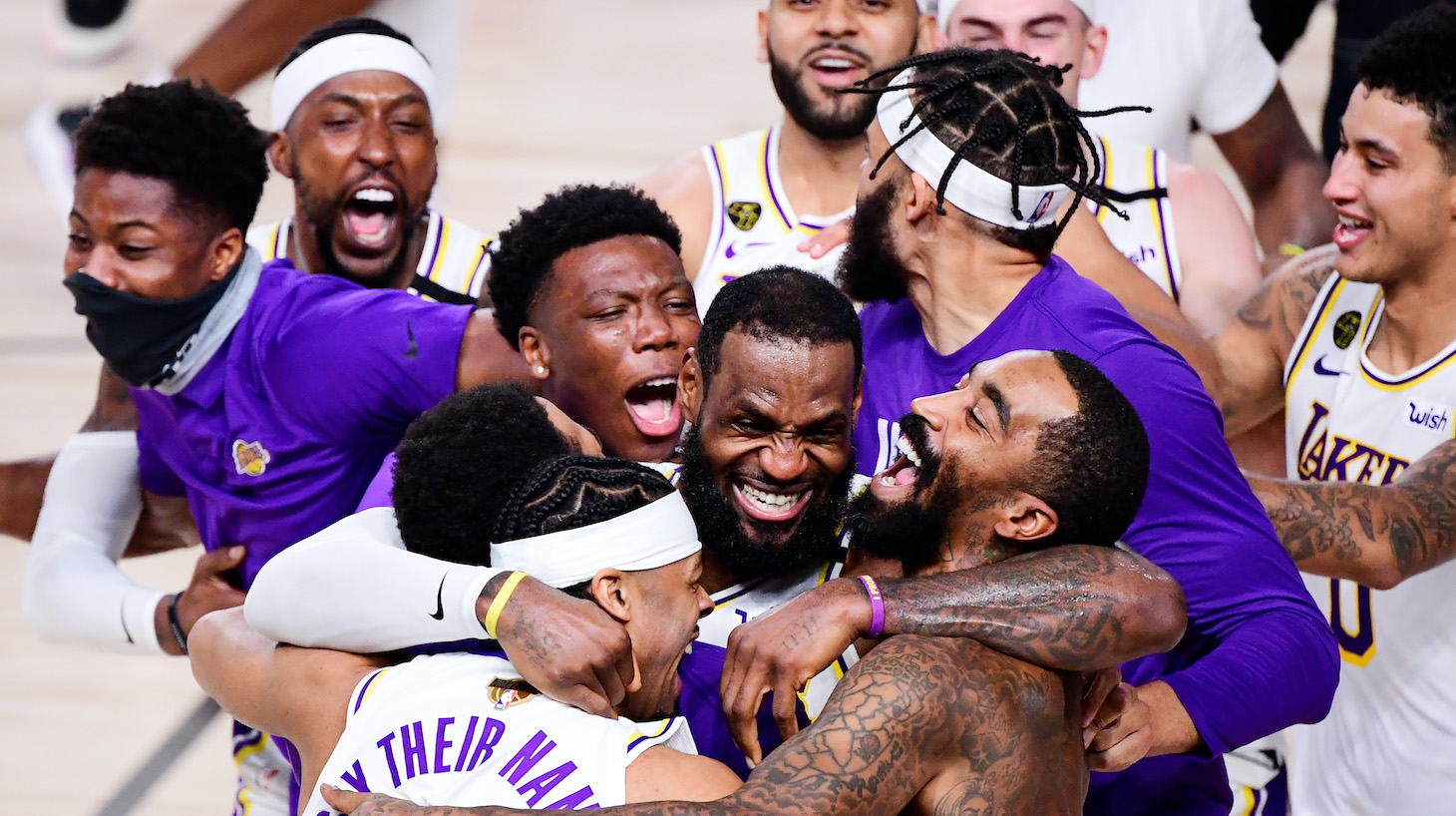 LAKE BUENA VISTA, FLORIDA - OCTOBER 11: LeBron James #23 of the Los Angeles Lakers celebrates with Quinn Cook #28 of the Los Angeles Lakers and teammates after winning the 2020 NBA Championship in Game Six of the 2020 NBA Finals at AdventHealth Arena at the ESPN Wide World Of Sports Complex on October 11, 2020 in Lake Buena Vista, Florida. NOTE TO USER: User expressly acknowledges and agrees that, by downloading and or using this photograph, User is consenting to the terms and conditions of the Getty Images License Agreement. (Photo by Douglas P. DeFelice/Getty Images)