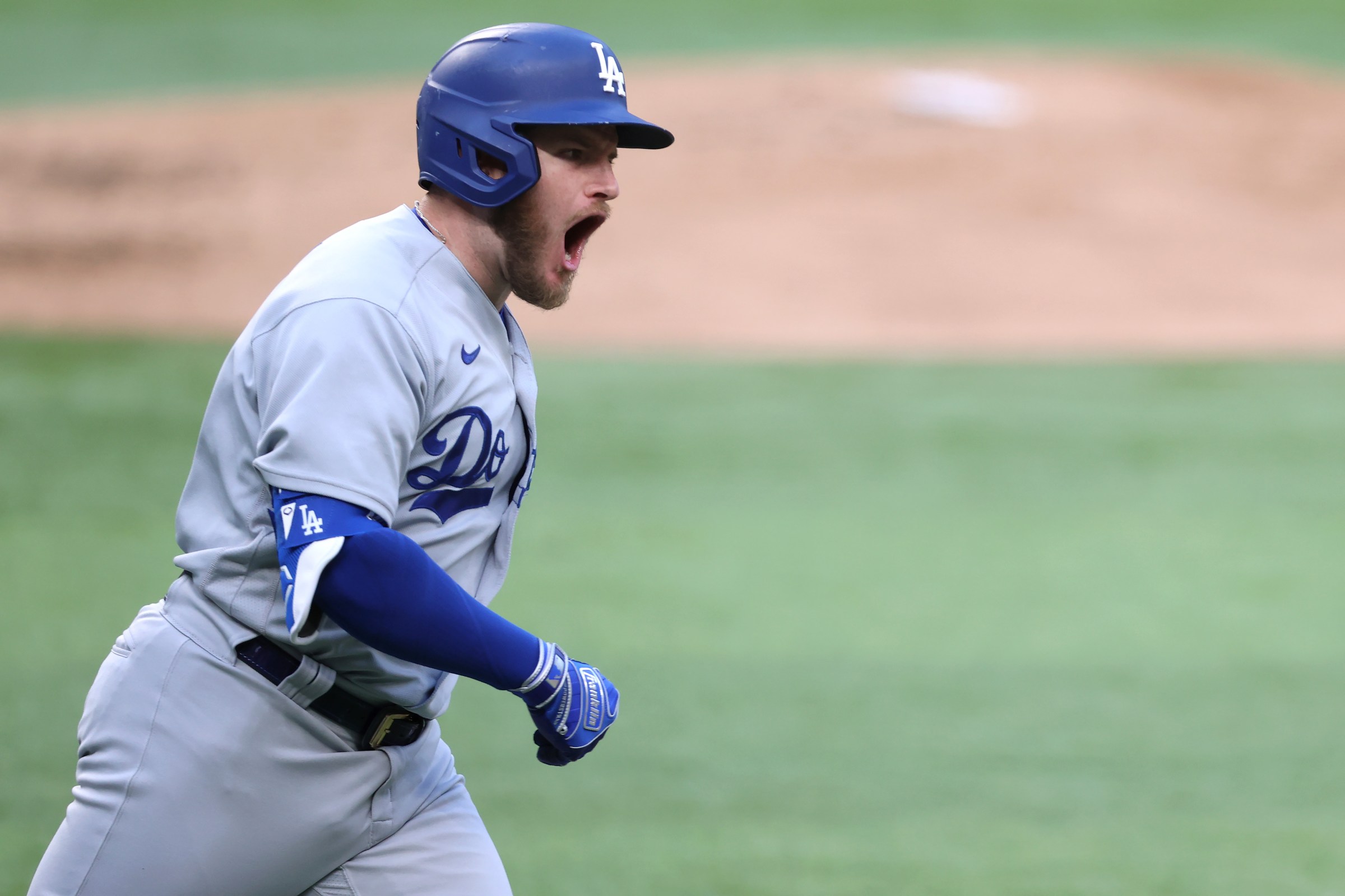 Max Muncy of the Dodgers celebrates a grand slam in Game 3 of the NLCS.
