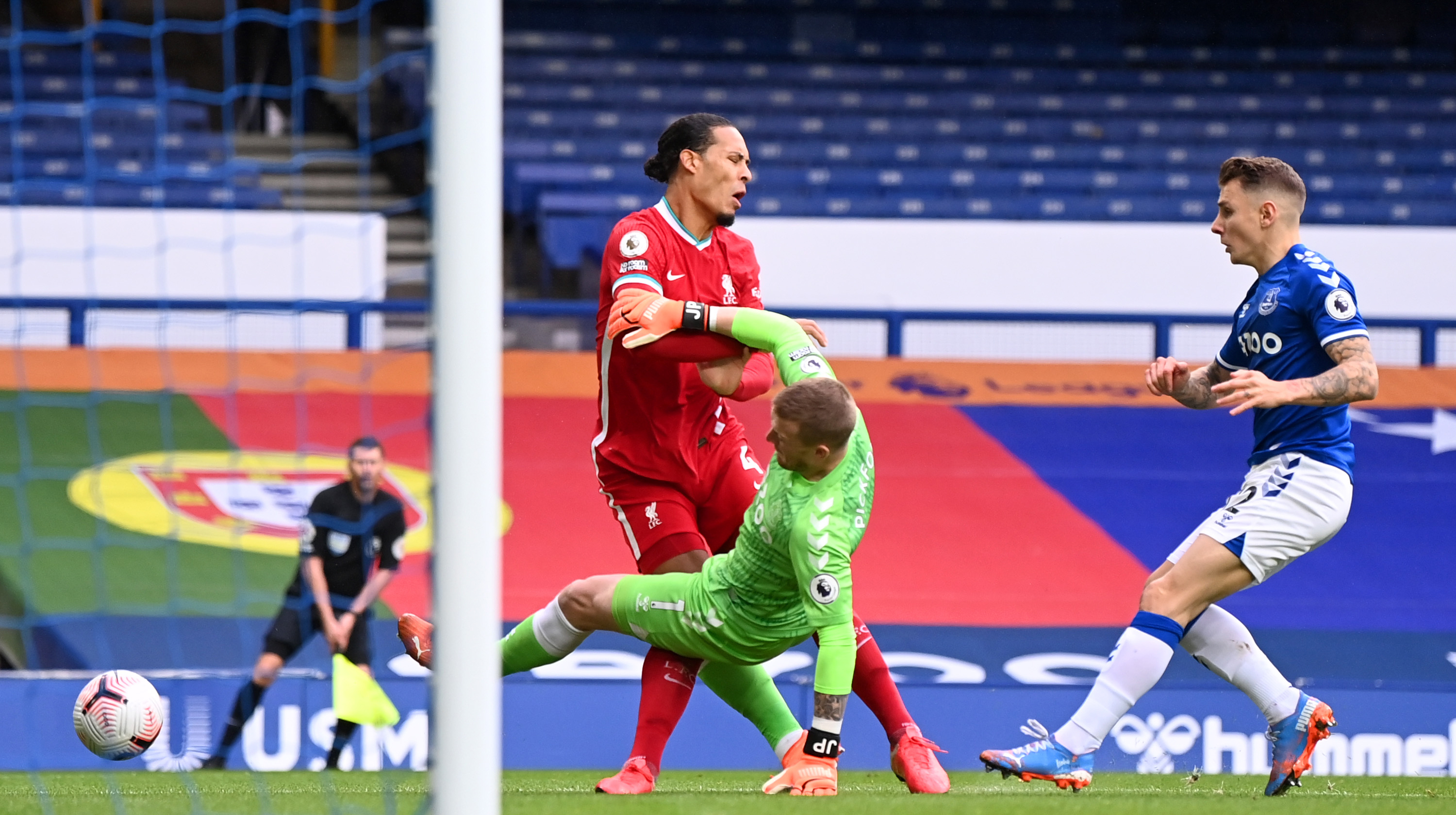 Virgil van Dijk of Liverpool is tackled by Jordan Pickford of Everton which led to Virgil van Dijk being substituted for an injury during the Premier League match between Everton and Liverpool