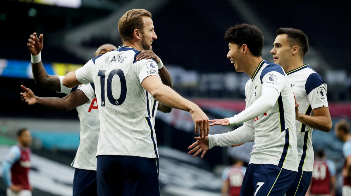 Harry Kane of Tottenham Hotspur celebrates with teammates after scoring his team's second goal during the Premier League match between Tottenham Hotspur and West Ham United at Tottenham Hotspur Stadium on October 18, 2020 in London, England. Sporting stadiums around the UK remain under strict restrictions due to the Coronavirus Pandemic as Government social distancing laws prohibit fans inside venues resulting in games being played behind closed doors.