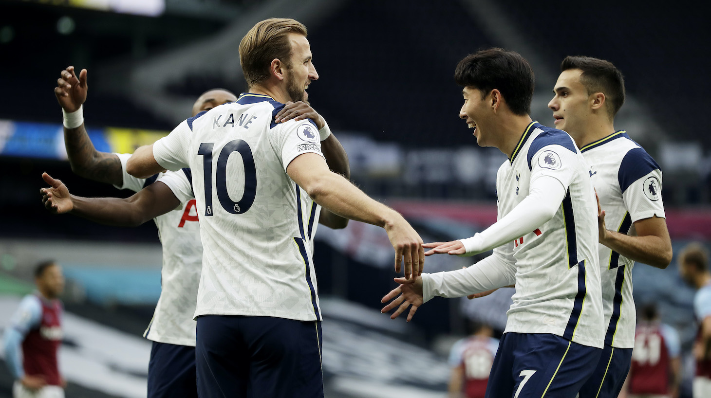 Harry Kane of Tottenham Hotspur celebrates with teammates after scoring his team's second goal during the Premier League match between Tottenham Hotspur and West Ham United at Tottenham Hotspur Stadium on October 18, 2020 in London, England. Sporting stadiums around the UK remain under strict restrictions due to the Coronavirus Pandemic as Government social distancing laws prohibit fans inside venues resulting in games being played behind closed doors.