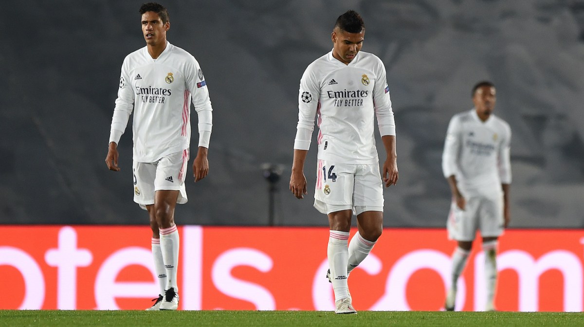 Raphael Varane and Carlos Casimiro of Real Madrid look dejected after conceding a third goal during the UEFA Champions League Group B stage match between Real Madrid and Shakhtar Donetsk at Estadio Alfredo Di Stefano on October 21, 2020 in Madrid, Spain.