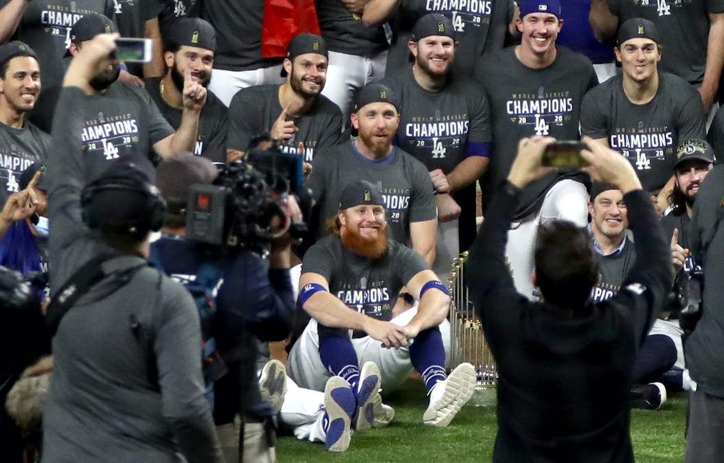 ARLINGTON, TEXAS - OCTOBER 27: Justin Turner #10 and the Los Angeles Dodgers pose for a photo after defeating the Tampa Bay Rays 3-1 in Game Six to win the 2020 MLB World Series at Globe Life Field on October 27, 2020 in Arlington, Texas. (Photo by Ronald Martinez/Getty Images)