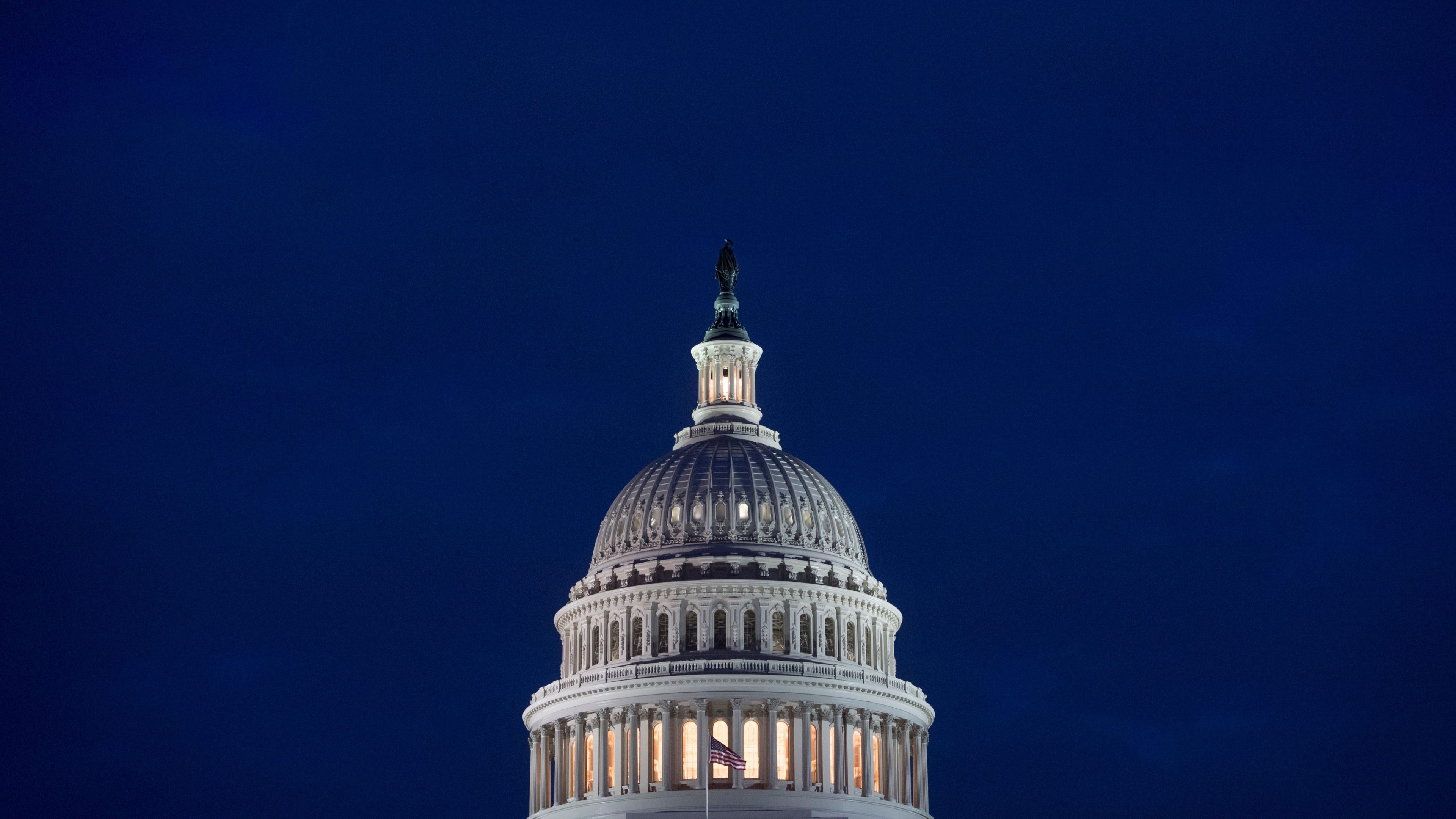 The US Capitol Building is seen at dusk in Washington, DC.