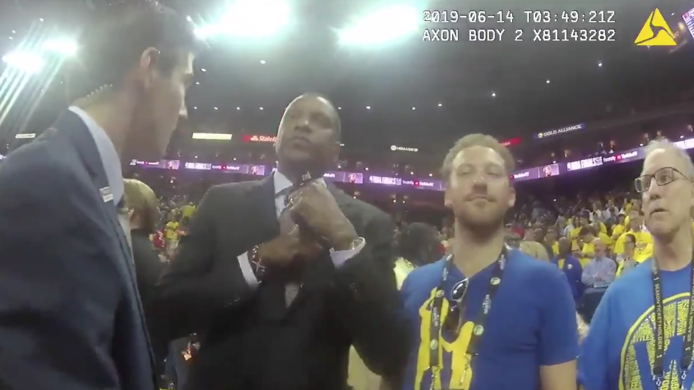 Masai Ujiri pulling out his credentials before being shoved.