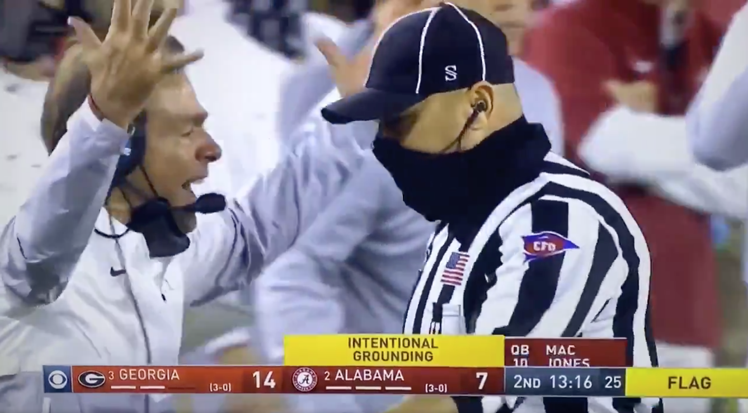 Nick Saban, not wearing a mask, yells at a referee