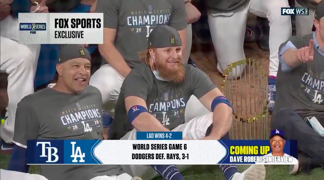Justin Turner of the Dodgers sits for team photo after testing positive for coronavirus midgame