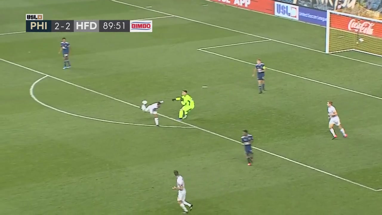 A player stops a goalie's throw with his foot, and the ball bounces into the net