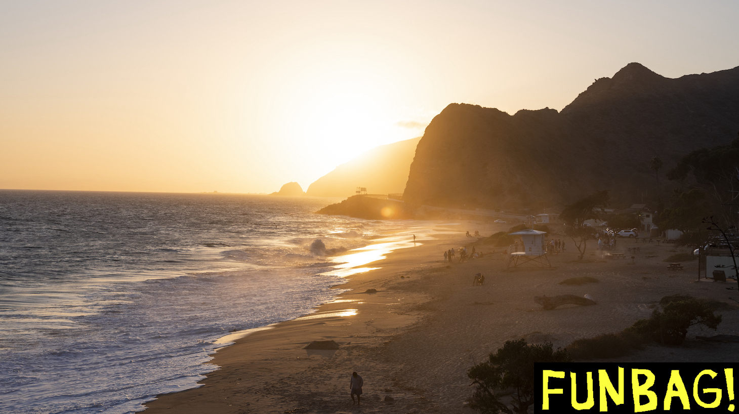 POINT MUGU, SOUTHERN CALIFORNIA: Beachgoers catch the last of the sunset light in the ocean alongside the Pacific Coast Highway ahead of July 4th weekend. Most Beaches and beach parking will be closed from the 3rd through to the 5th of July as California fights rising Covid-19 infections. (Photo by Brent Stirton/Getty Images)