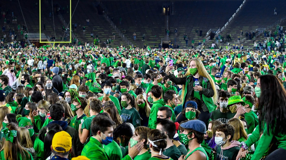 Fans storm the field after the Notre Dame Fighting Irish defeated the Clemson Tigers 47-40 in double overtime at Notre Dame Stadium on November 7, 2020
