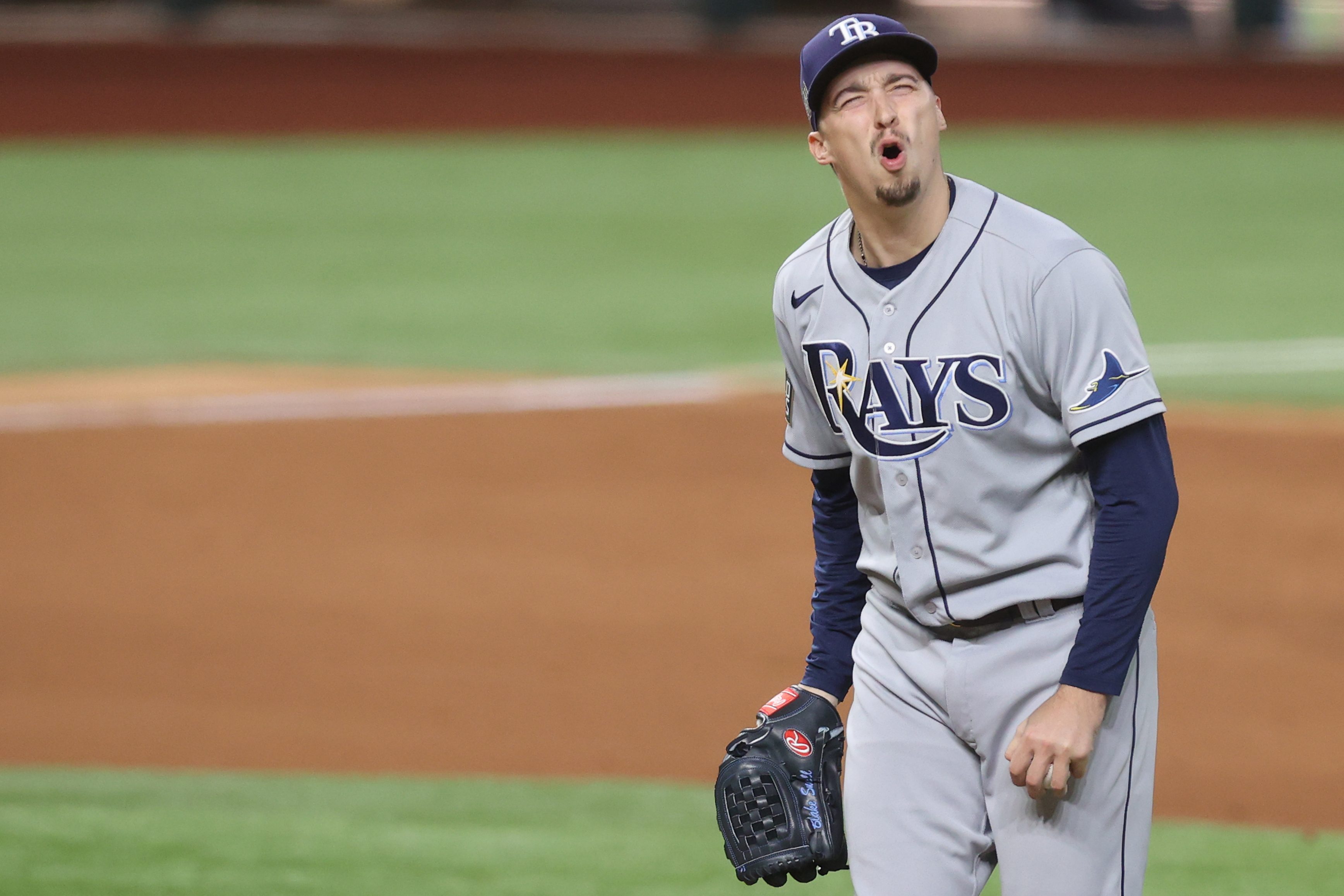 Blake Snell #4 of the Tampa Bay Rays reacts as he is being taken out of the game