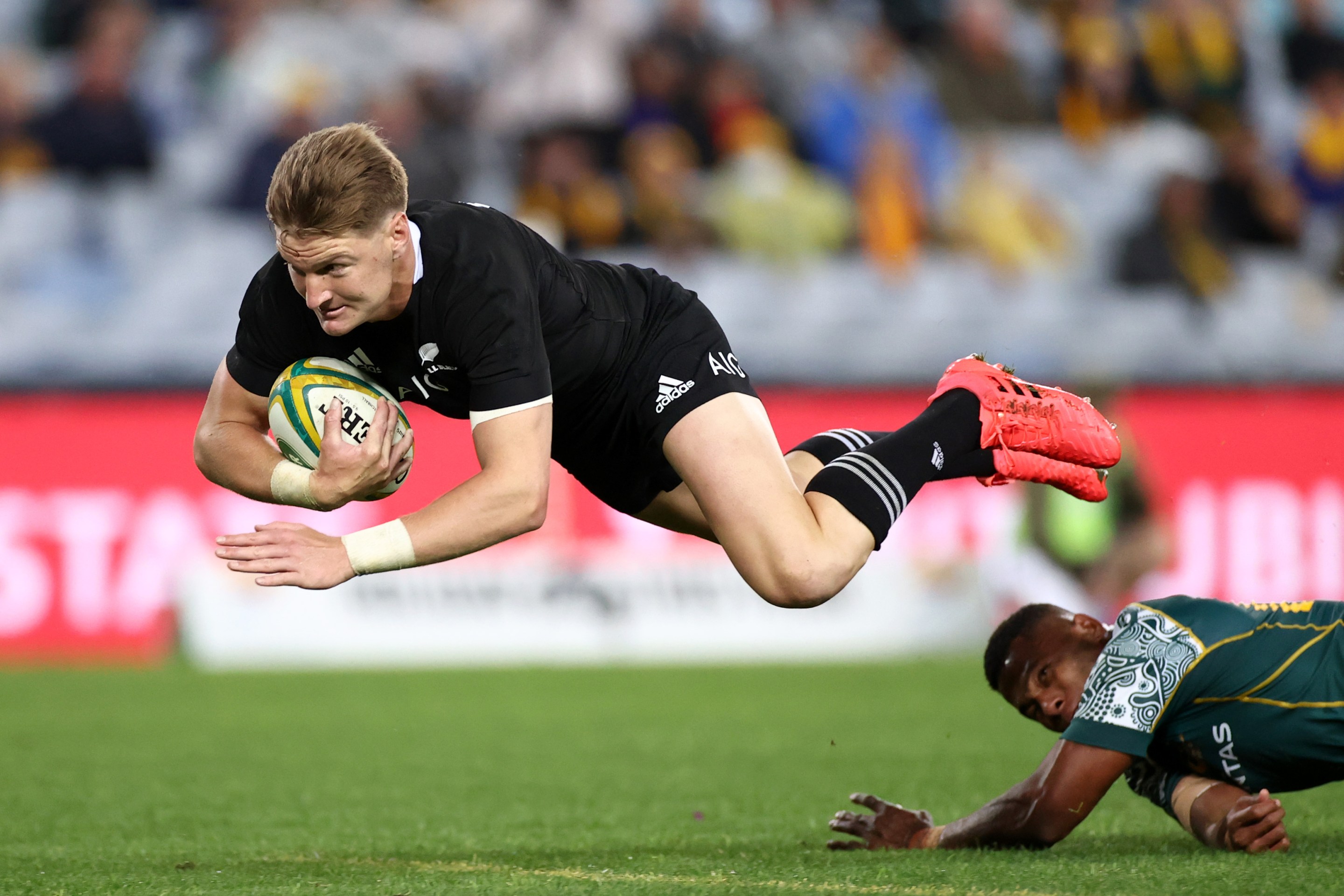 Jordie Barrett of the All Blacks dives over to score a try