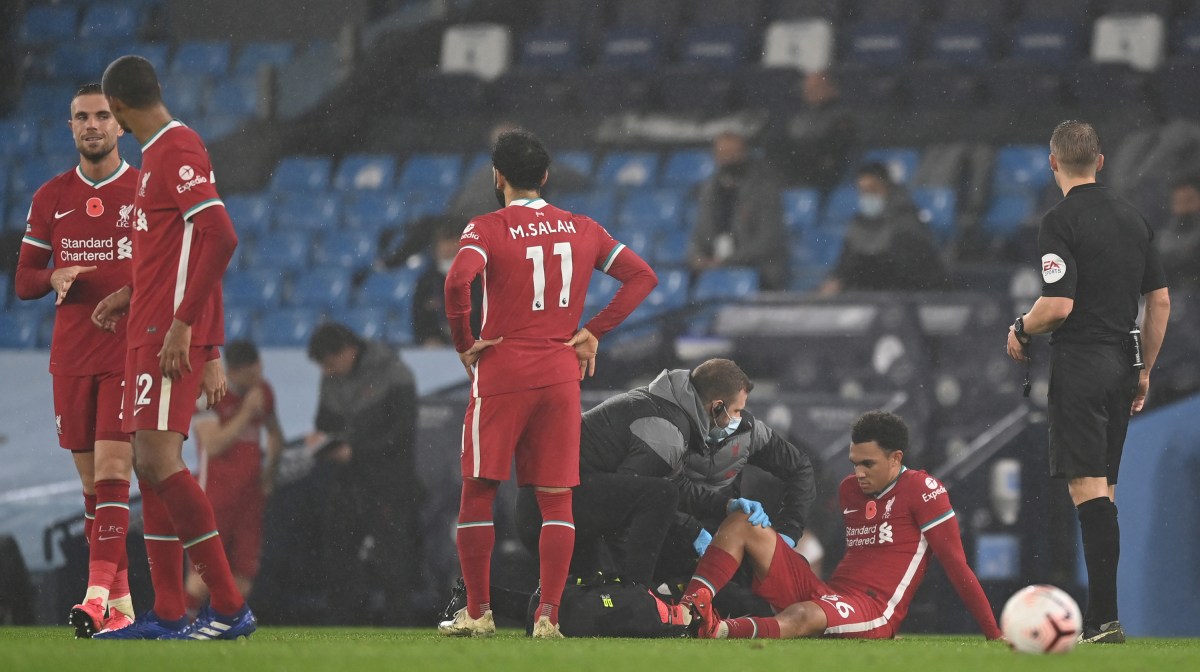 Trent Alexander-Arnold of Liverpool receives medical treatment during the Premier League match between Manchester City and Liverpool at Etihad Stadium on November 08, 2020