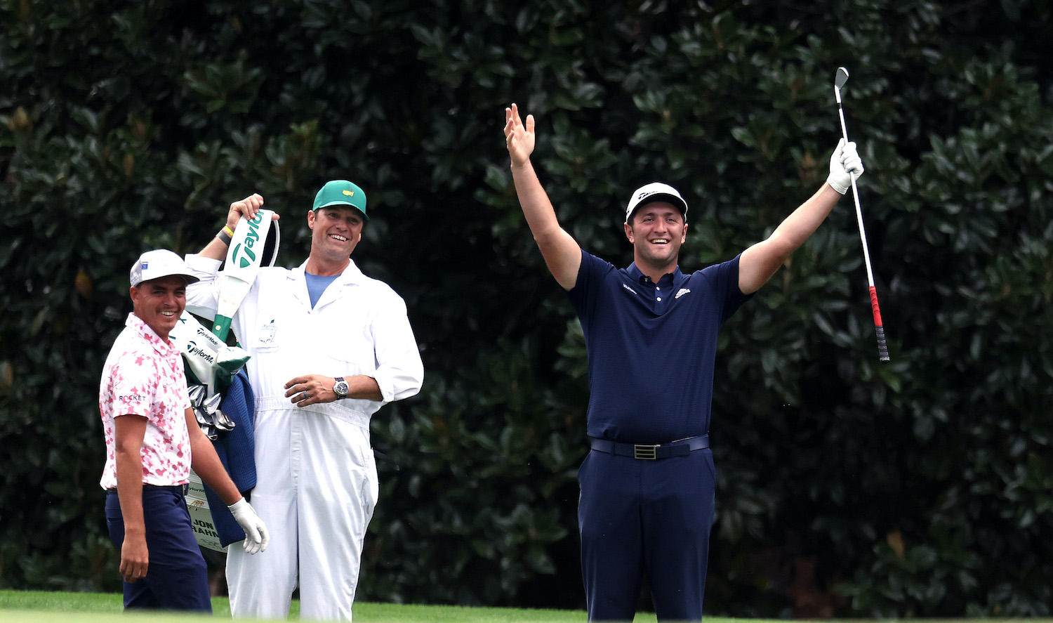 AUGUSTA, GEORGIA - NOVEMBER 10: Jon Rahm of Spain celebrates with Rickie Fowler of the United States after skipping in for a hole in one on the 16th during a practice round prior to the Masters at Augusta National Golf Club on November 10, 2020 in Augusta, Georgia. (Photo by Rob Carr/Getty Images)