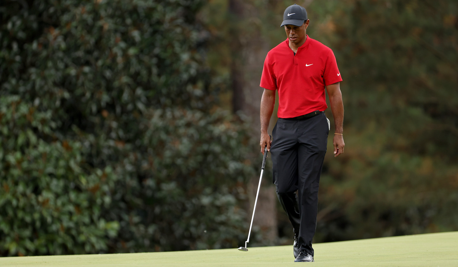 AUGUSTA, GEORGIA - NOVEMBER 15: Tiger Woods of the United States walks on the 14th green during the final round of the Masters at Augusta National Golf Club on November 15, 2020 in Augusta, Georgia. (Photo by Jamie Squire/Getty Images)