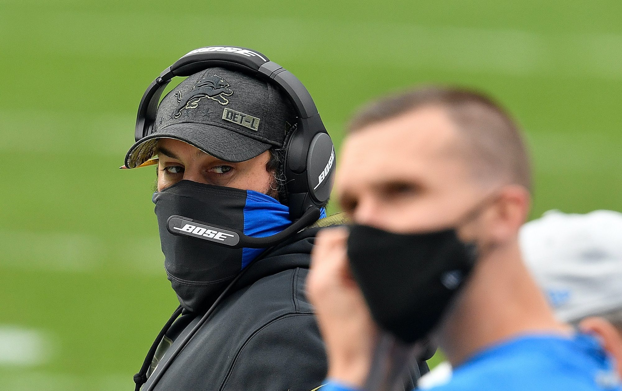 Matt Patricia wears a mask and looks cagey on the Lions sideline.