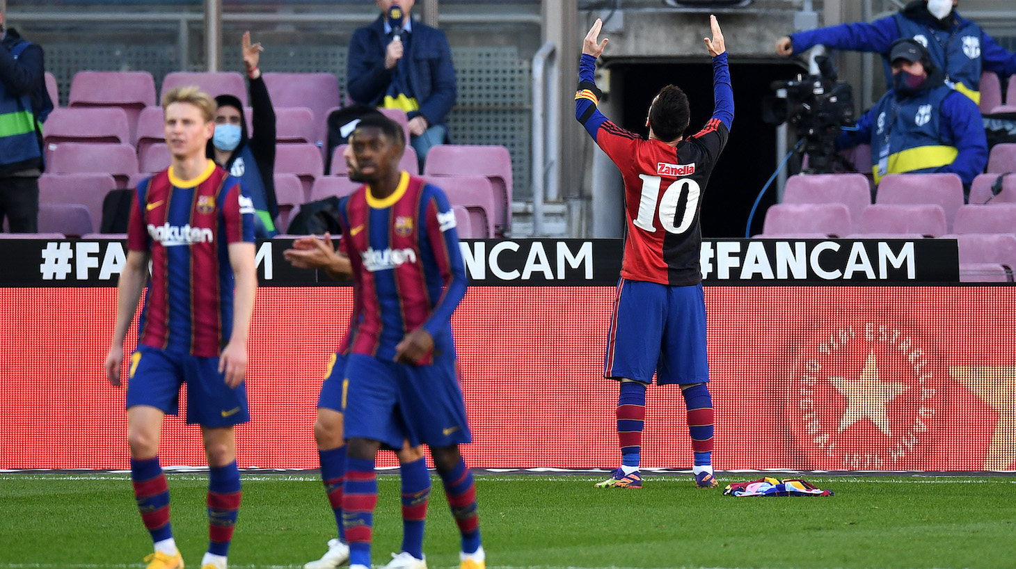 Lionel Messi of Barcelona celebrates after scoring their sides fourth goal while wearing a Newell's Old Boys shirt with the number 10 on the back in memory of former footballer, Diego Maradona, who recently passed away during the La Liga Santander match between FC Barcelona and C.A. Osasuna at Camp Nou on November 29, 2020 in Barcelona, Spain. Sporting stadiums around Spain remain under strict restrictions due to the Coronavirus Pandemic as Government social distancing laws prohibit fans inside venues resulting in games being played behind closed doors.