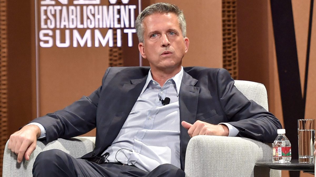 Bill Simmons sits in an armchair looking like an asshole