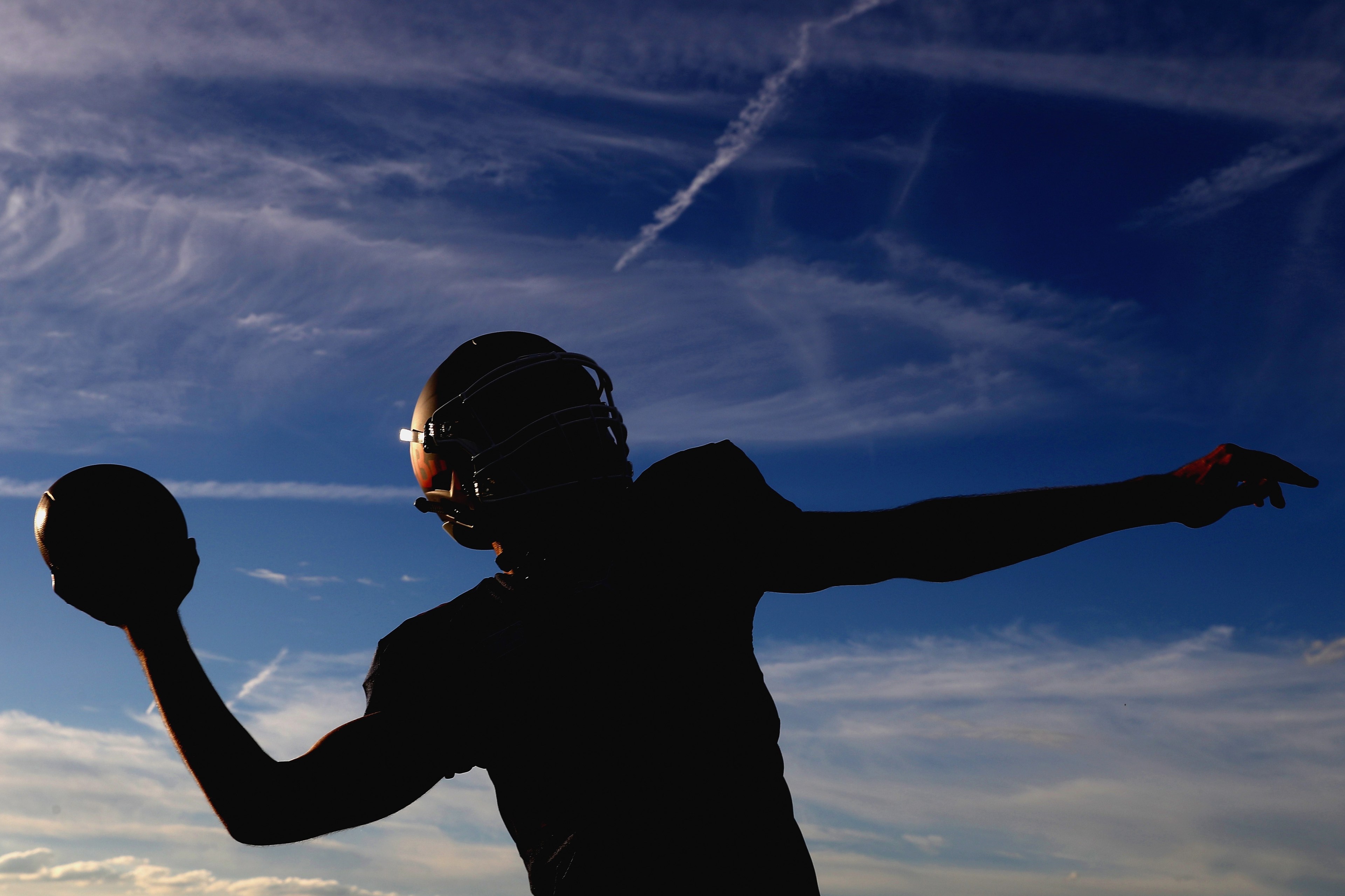 This is a Dutch guy affiliated with Red Bull Racing throwing a football. I just liked the photo.
