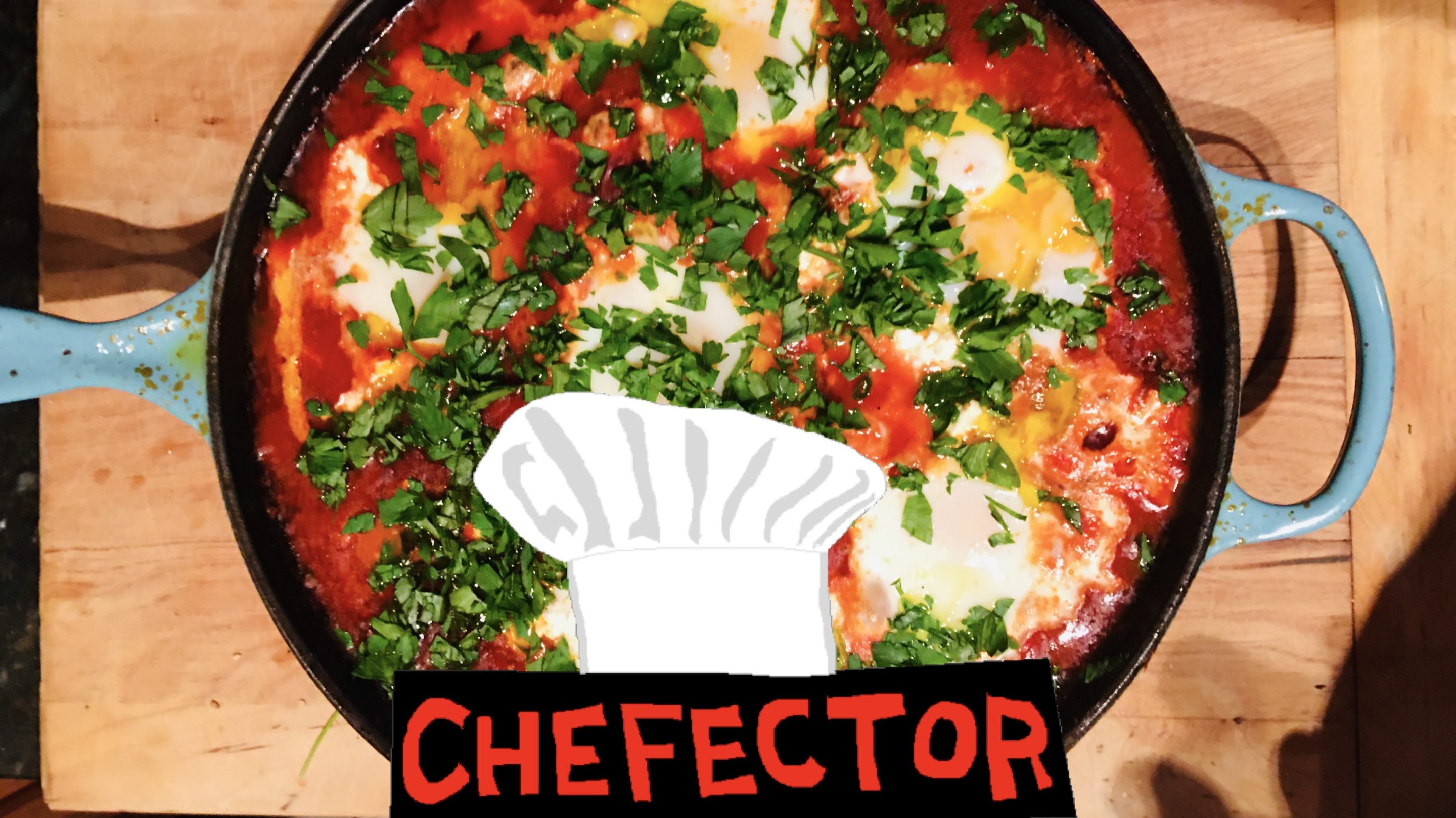 A pan of shakshouka, eggs poached in tomatoes and peppers