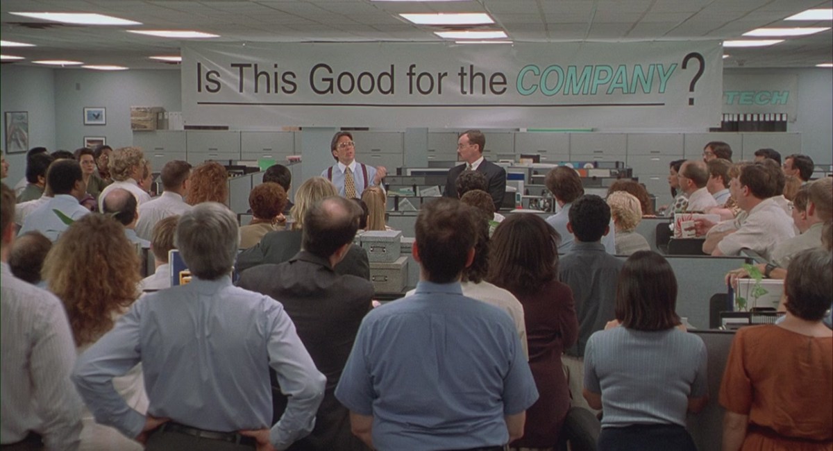 A scene of a meeting from Office Space, a Mike Judge film.